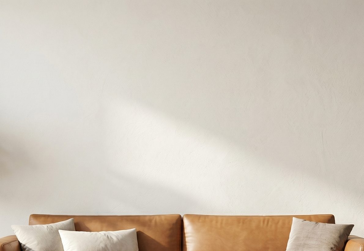 Living-room wall + sofa lifestyle backdrop for the Format Preview section